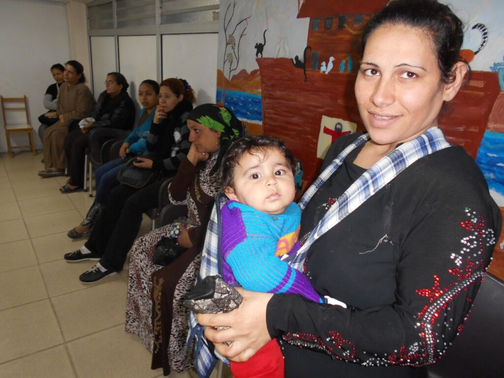 An excited mother with child visits Not Another Child center