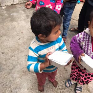 Children are happy after receiving food packets