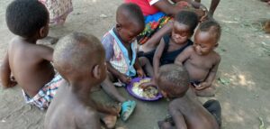 Group of children in Malawi enjoying a meal together