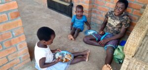 Malawi children having food at Not Another Child center