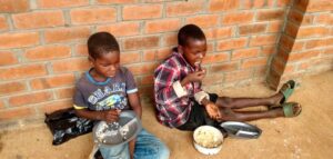 Two children having a meal at Not Another Child