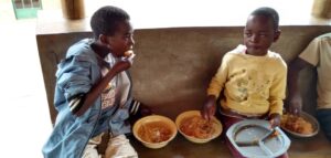 Children having food at Not Another Child center