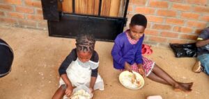 Malawi children enjoying a meal at Not Another Child center