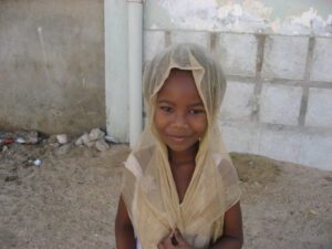 A young girl in Mauritania poses for the camera
