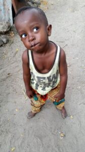 Tanzanian Child poses stylishly for the camera