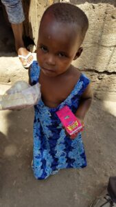 A young girl in Tanzania after receiving food