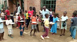 Group of children during meal time at the center